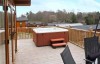 log cabin white cross bay with hot tub